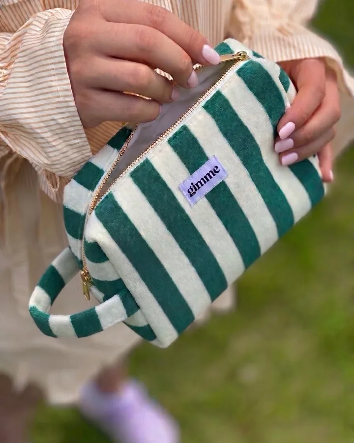 Green and white striped makeup pouch